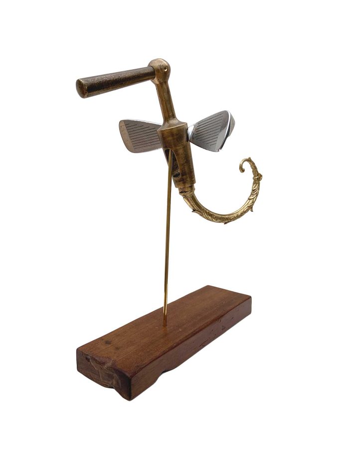 Sculptural bird made from golf club heads mounted on a wooden base – main view