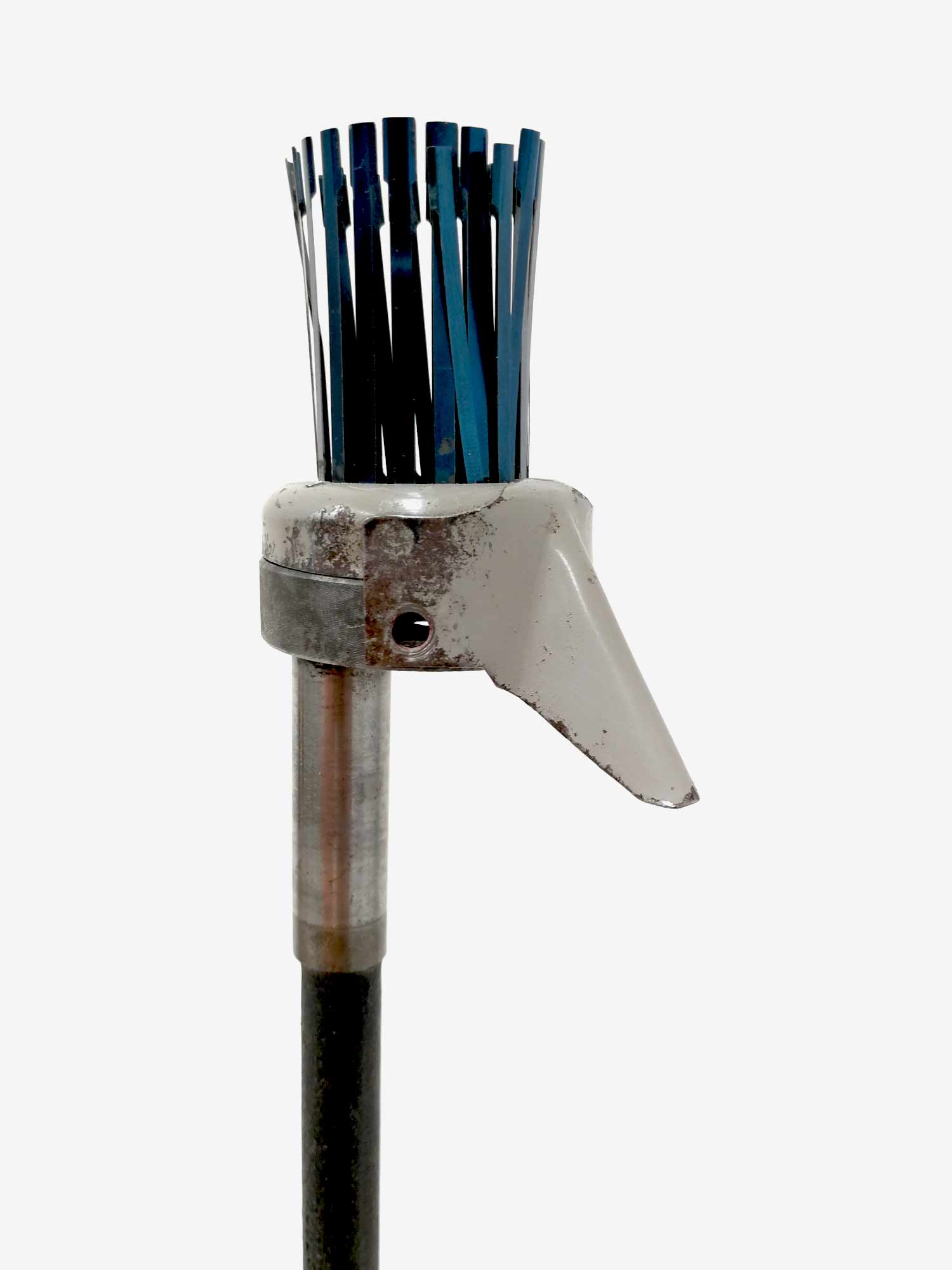 A tall sculptural bird made from a sewing machine part and wires as a crest - detail