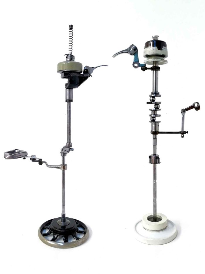 A pair of sculptural birds made from sewing machine parts