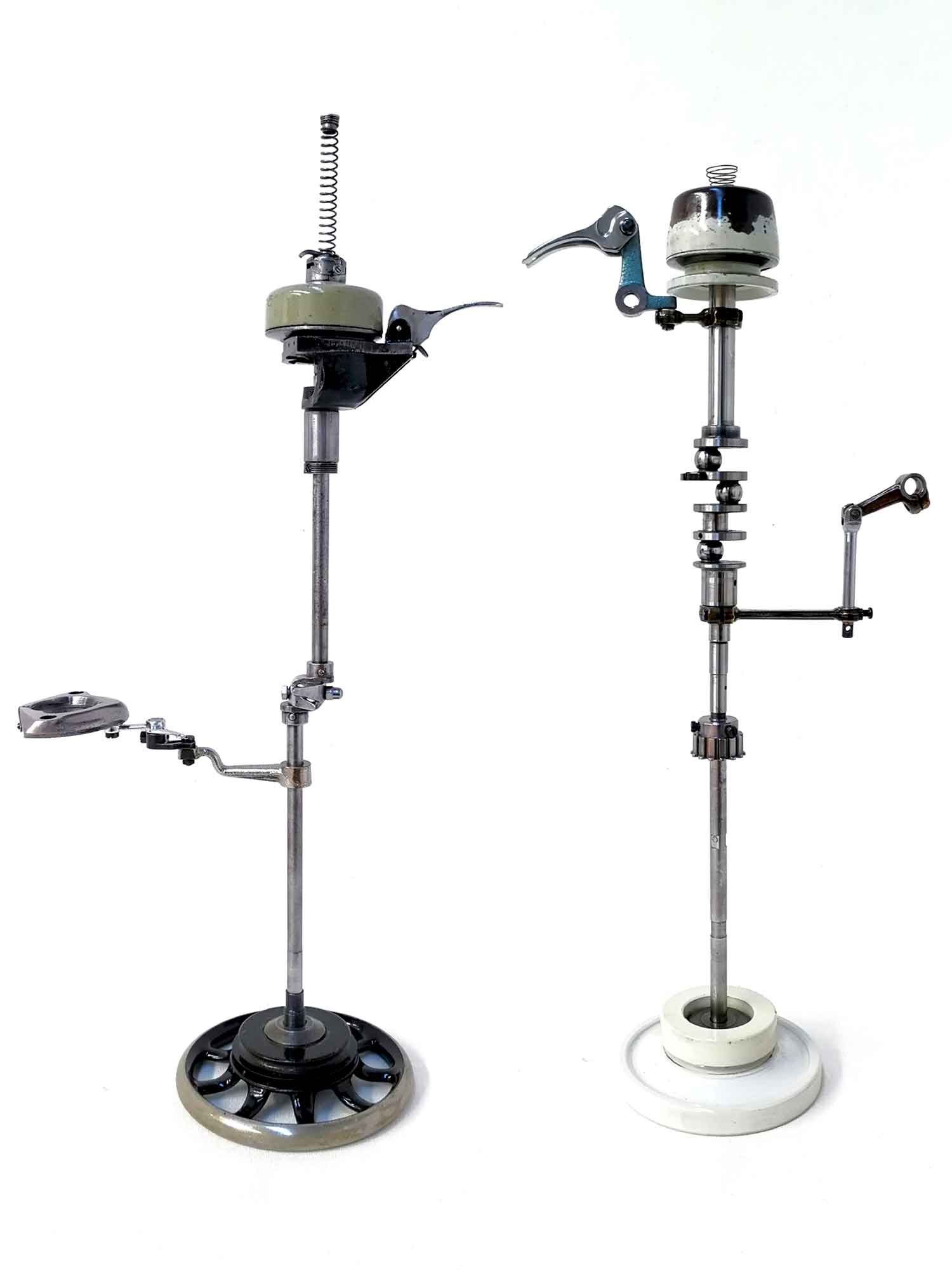 A pair of sculptural birds made from sewing machine parts